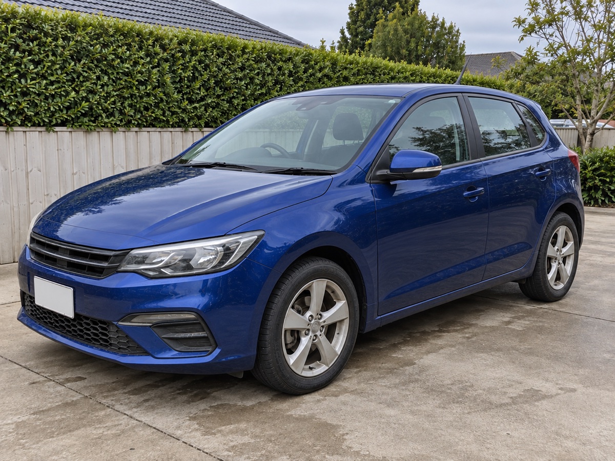 The same blue hatchback after washing, with clean paint and wheels
